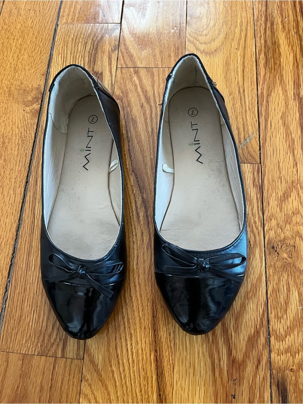 Free with purchase. Mint Black Patent Ballet Flats with Bow Accent